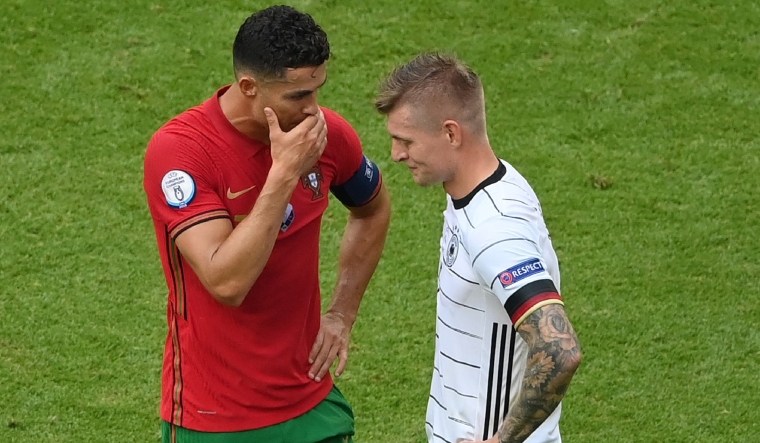 Portuhal captain Cristiano Ronaldo (L) and German midfielder Toni Kroos are among the veteran campaigners of UEFA EURO 2024